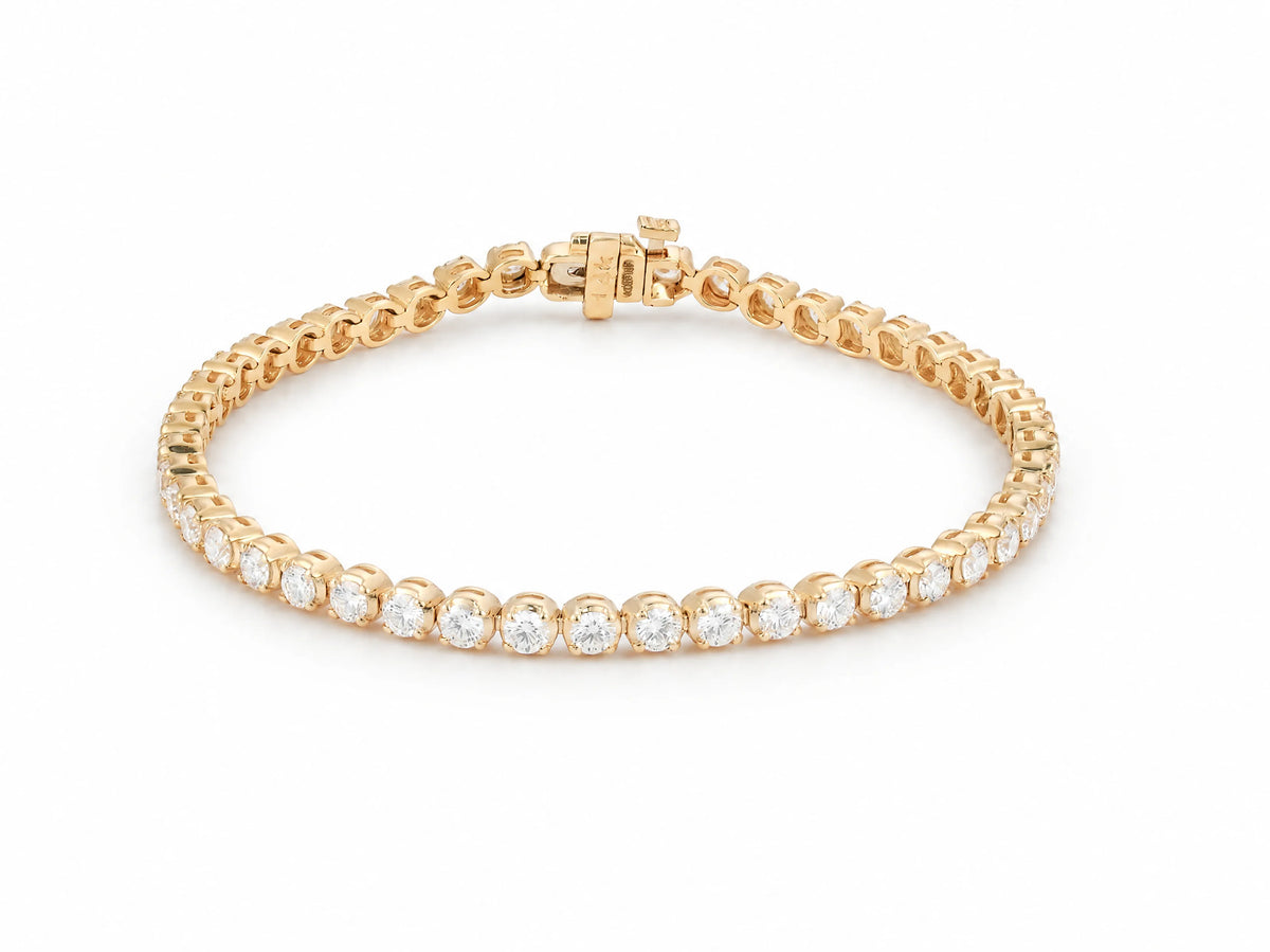 14K yellow gold tennis bracelet from a second angle, continuous row of round lab grown diamonds in gold settings