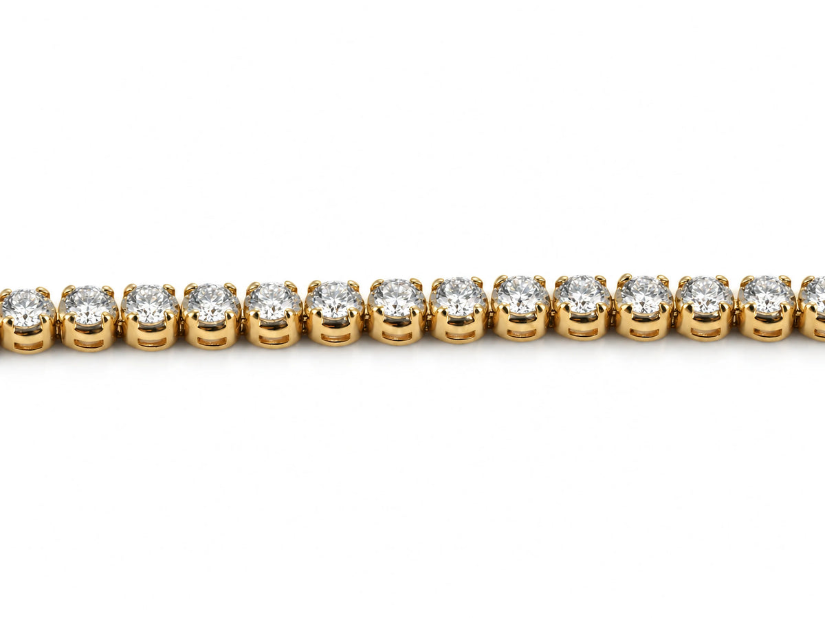 Straight segment of the tennis bracelet, round diamonds in individual four-prong yellow gold baskets