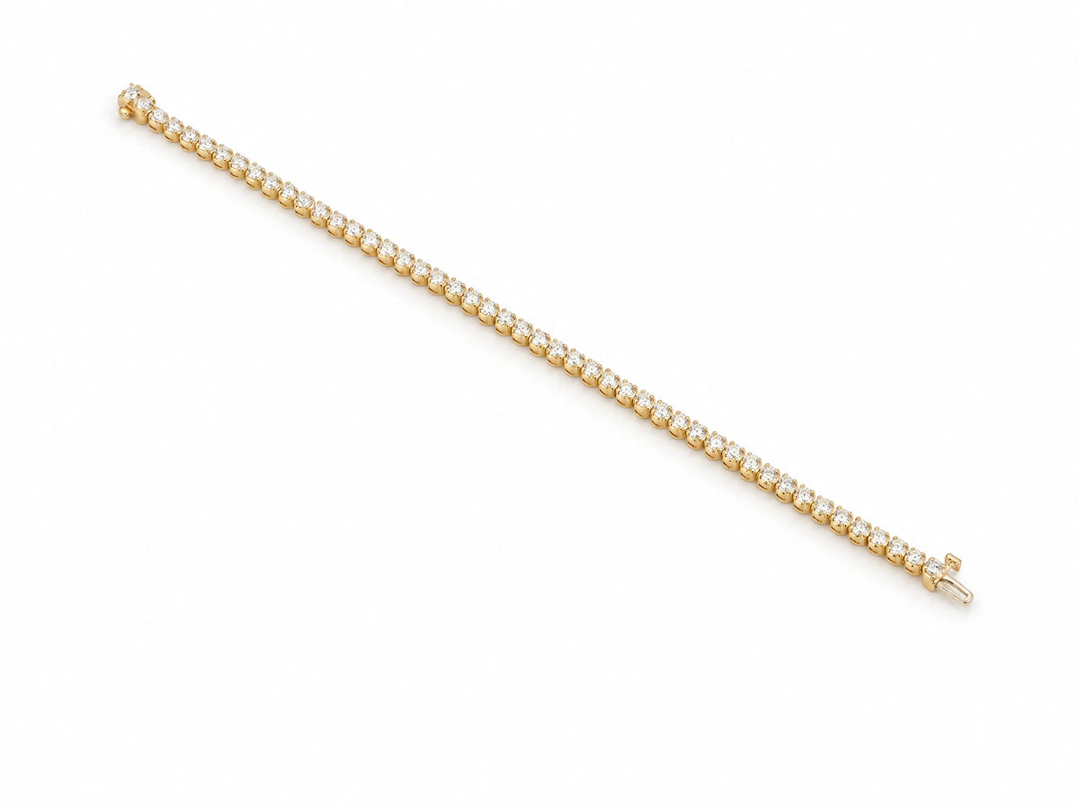 Tennis bracelet laid open, the box clasp and its safety latch visible at one end