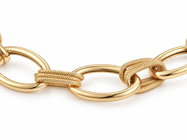 Clasp area of the gold bracelet with a curved bar, a large oval ring and flat plates