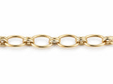 Overhead view of the gold bracelet with a row of oval links and double connectors