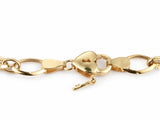 Macro detail of the heart-shaped padlock clasp with a tiny key hanging below