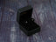 Earrings in a black jewelry box featuring Certified 18K Solid Gold Blue CZ Studs