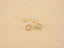 Gold star-shaped earrings with rhinestones in 18K Gold, part of Celestial Sparkle collection