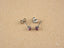 Silver stud earrings with pink gemstones from Luminous Spark 18k Gold Jewelry collection