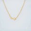 18k gold heart charm anklet with secure clasp detailing.