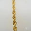 18k gold rope chain with intricate design and luxurious shine.
