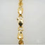 18k gold rope chain with intricate pattern and lobster clasp, showcasing timeless luxury and craftsmanship.