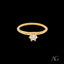 Gold solitaire ring with a round diamond in 18k cz, showcasing timeless elegance