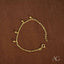 18k gold balls bracelet for kids featuring a gold chain and dangling ball charms