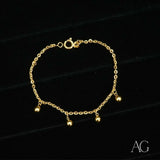 Shiny 18k gold balls bracelet for kids with dangling charms