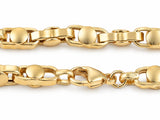 Macro of the lobster clasp and alternating links of an 18K yellow gold bracelet