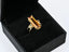 18K Gold Citrine Ring featuring a rectangular orange gemstone and side stones in art gold jewelry style