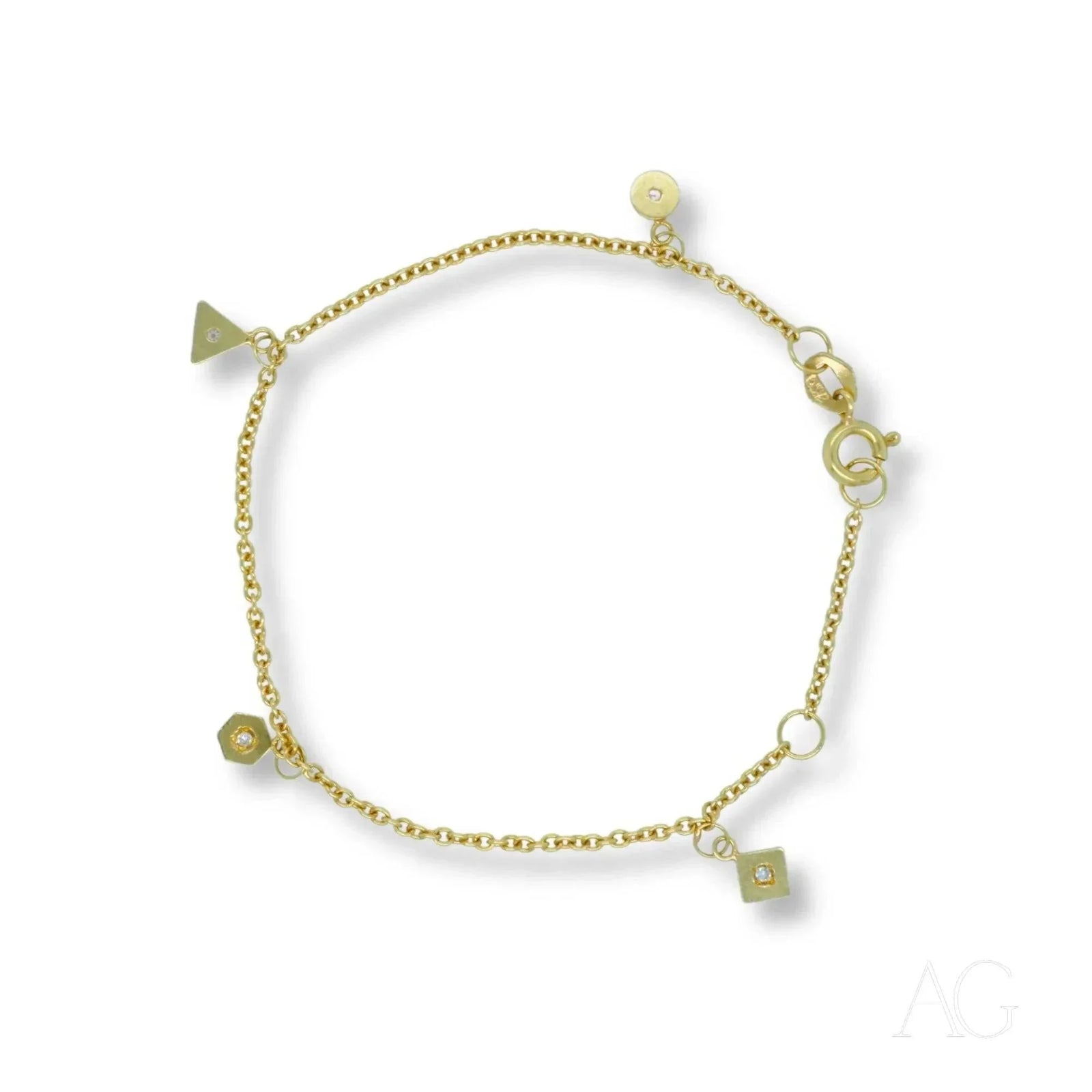 18K gold bracelet with geometric triangle, hexagon, square and disc charms with clear stones, lobster clasp, white background