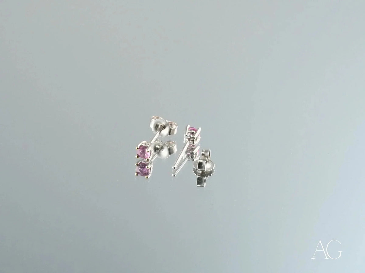 18K gold stud earrings with pink CZ stones, side view showing posts and butterfly backs