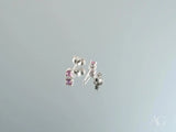 18K gold stud earrings with pink CZ stones, side view showing posts and butterfly backs