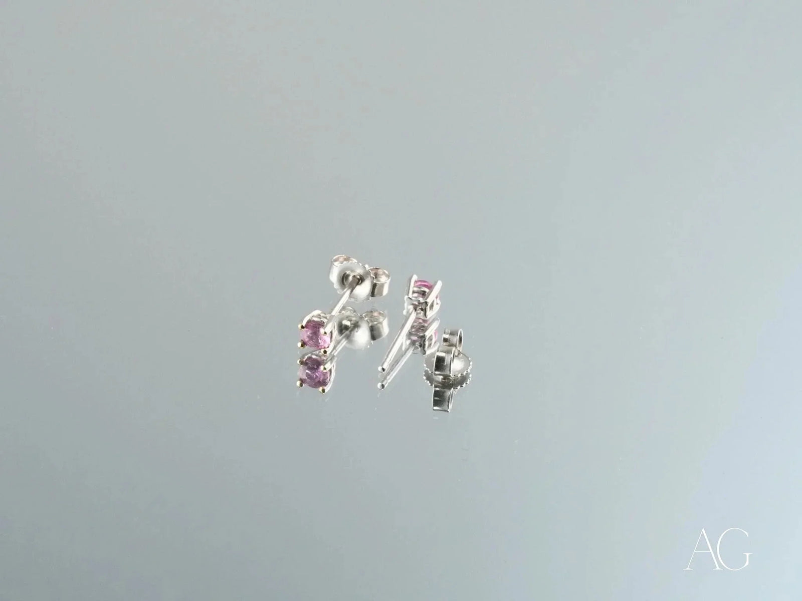 18K gold stud earrings with pink CZ stones, side view showing posts and butterfly backs