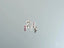 Silver stud earrings with pink gemstones, part of luminous spark art gold jewelry collection