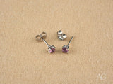18K gold stud earrings with purple CZ stones, side view showing posts and butterfly backs