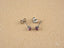 Silver stud earrings with purple gemstones from luminous spark art gold jewelry collection
