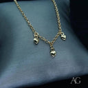 18k gold anklet with three dangling heart charms, a captivating creation in art gold jewelry