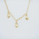 18k gold anklet with gold-toned chain and three dangling heart charms