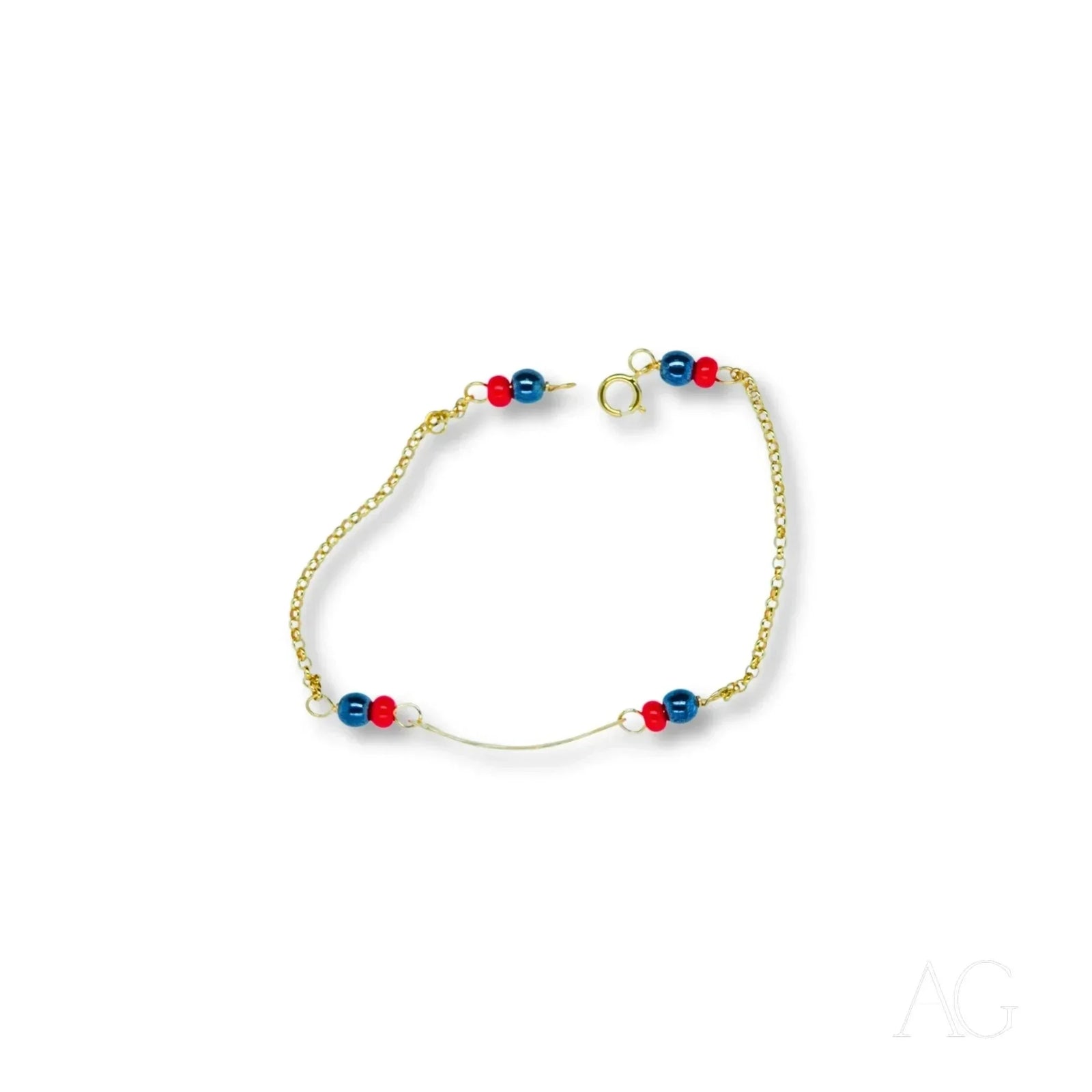 Child’s 18k gold bracelet with black coral and red blue beads