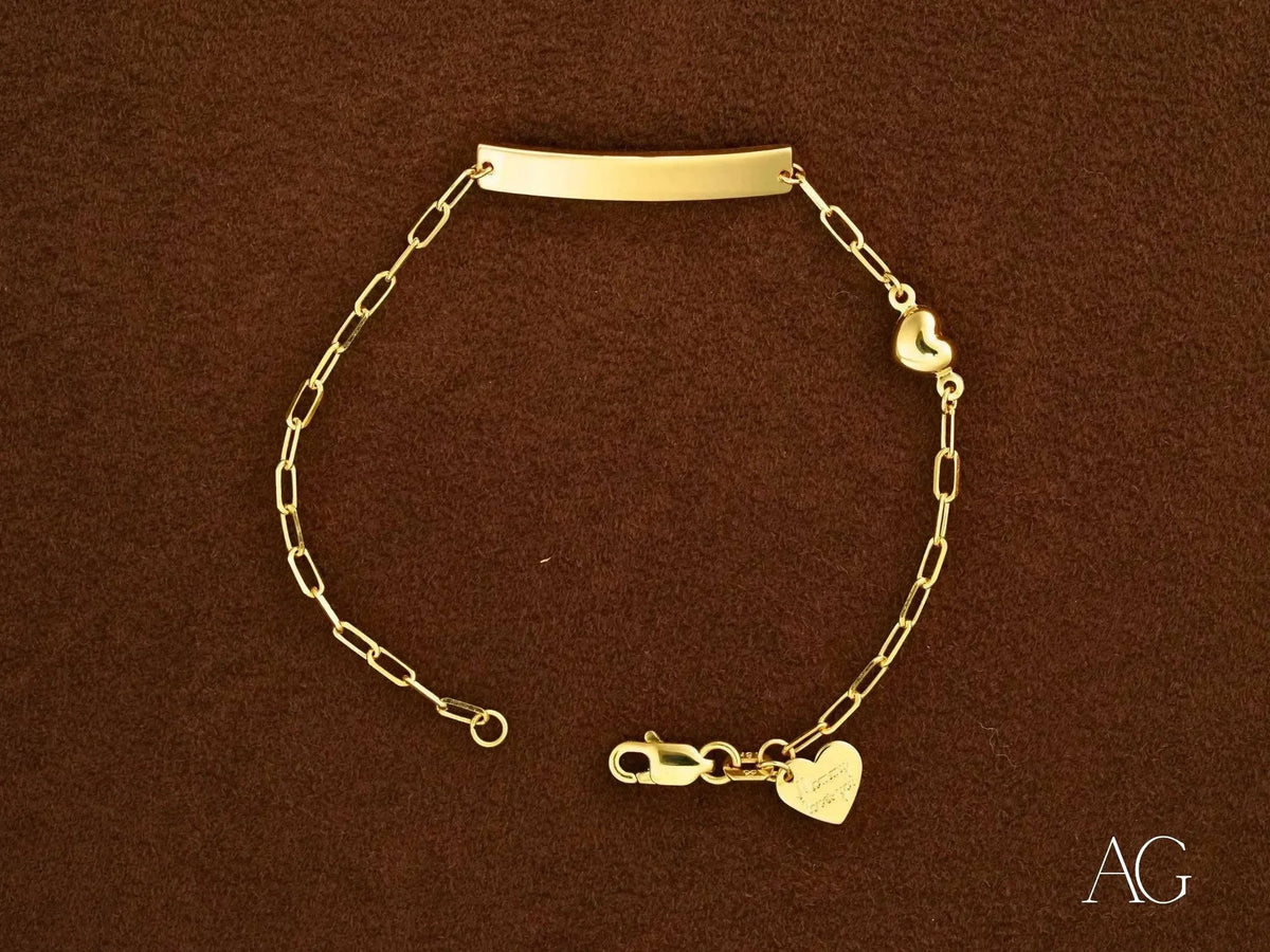 Solid 18k gold kids bracelet with customizable ID plate and heart charm