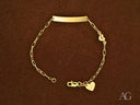 Solid 18k gold kids bracelet with customizable ID plate and heart charm