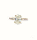 18k gold oval diamond engagement ring with pavé band