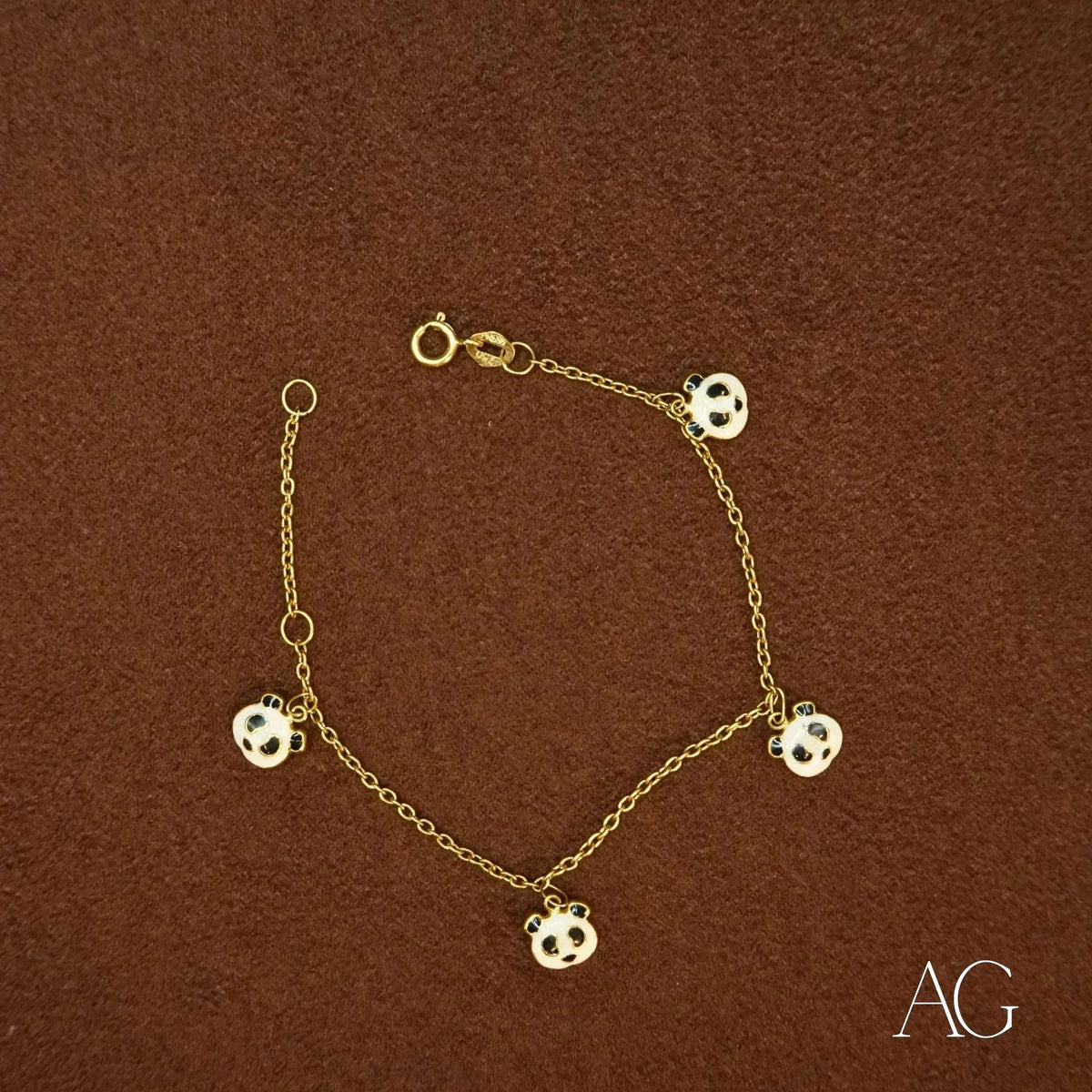 18k gold panda bracelet with five black and white panda motif charms
