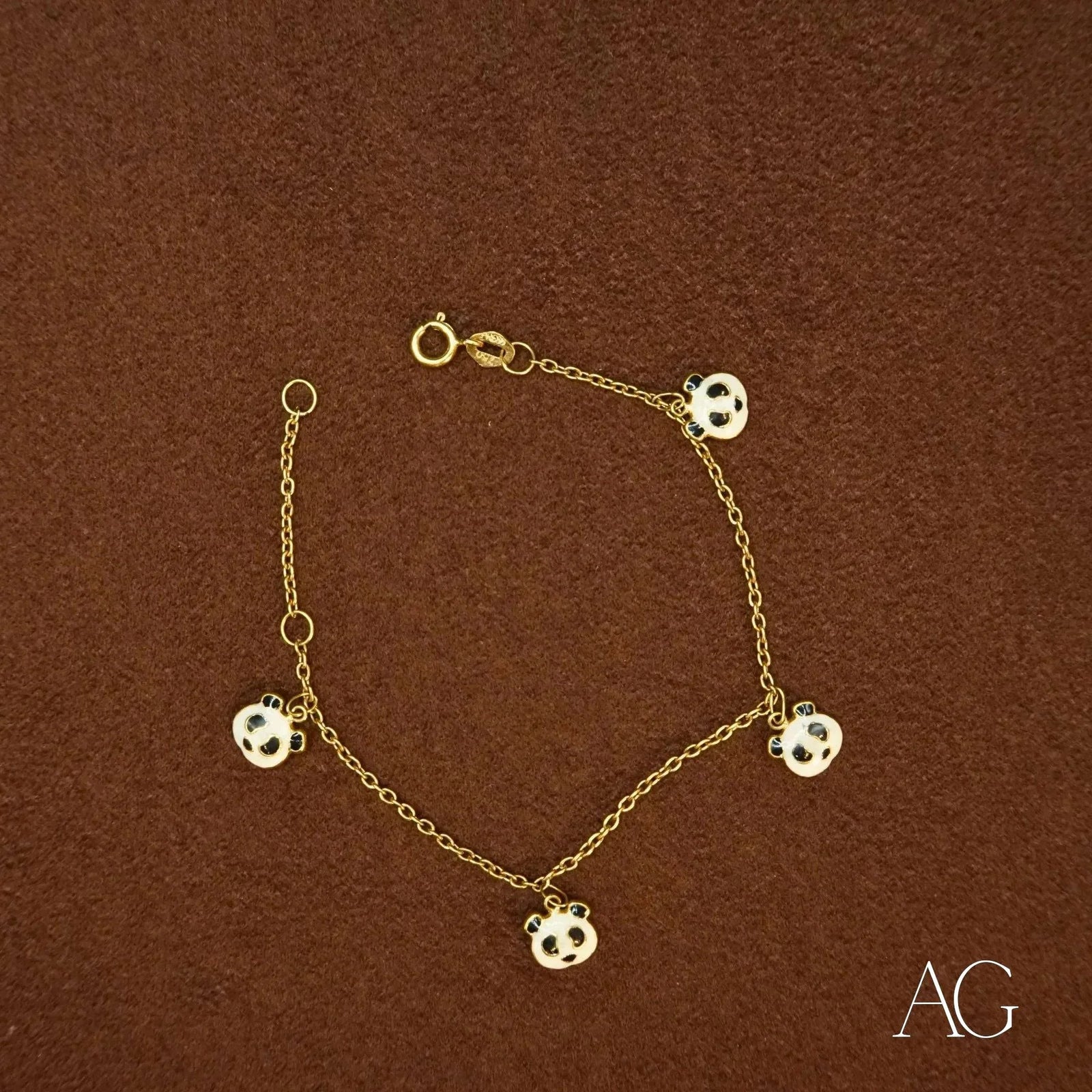 18k gold panda bracelet with five black and white panda motif charms