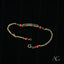 Gold-toned chain bracelet with rectangular ID plate and black coral beads for kids