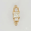 18k gold ring with 0.98ct princess-cut diamonds and accents