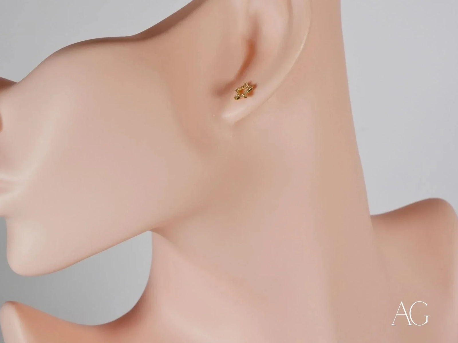 18K Gold Star Celestial Sparkle CZ Stud Earring on Earlobe