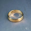 Brushed gold wedding band with patterned interior in 18k solid gold art gold jewelry collection