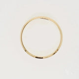 Shiny 18k solid gold wedding band with modern elegance