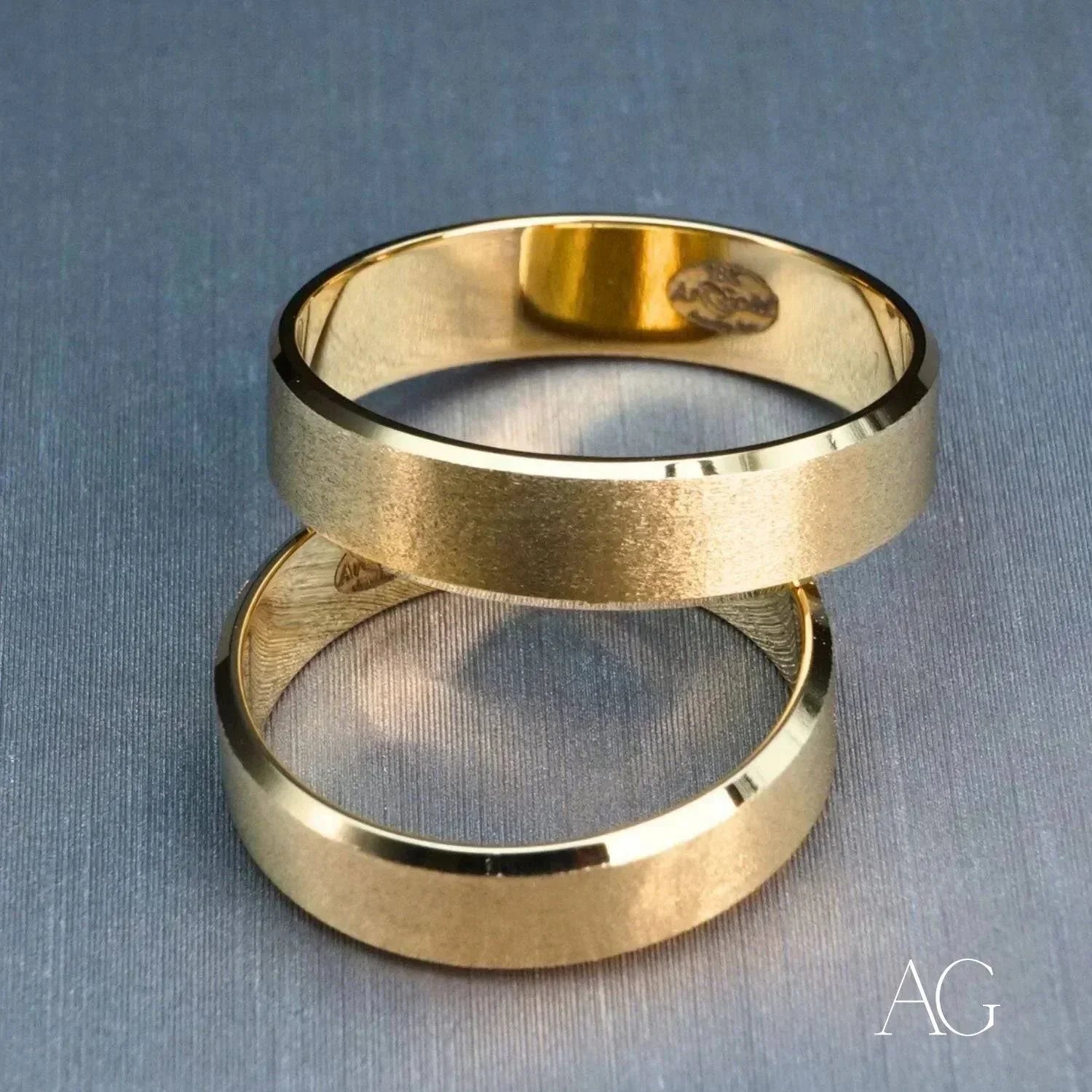 Two 18k solid gold wedding bands with brushed finish
