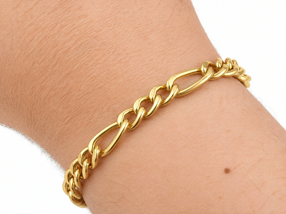 18K yellow gold Figaro bracelet worn on the wrist