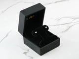18K white gold 4mm ball earrings in open black velvet jewelry box
