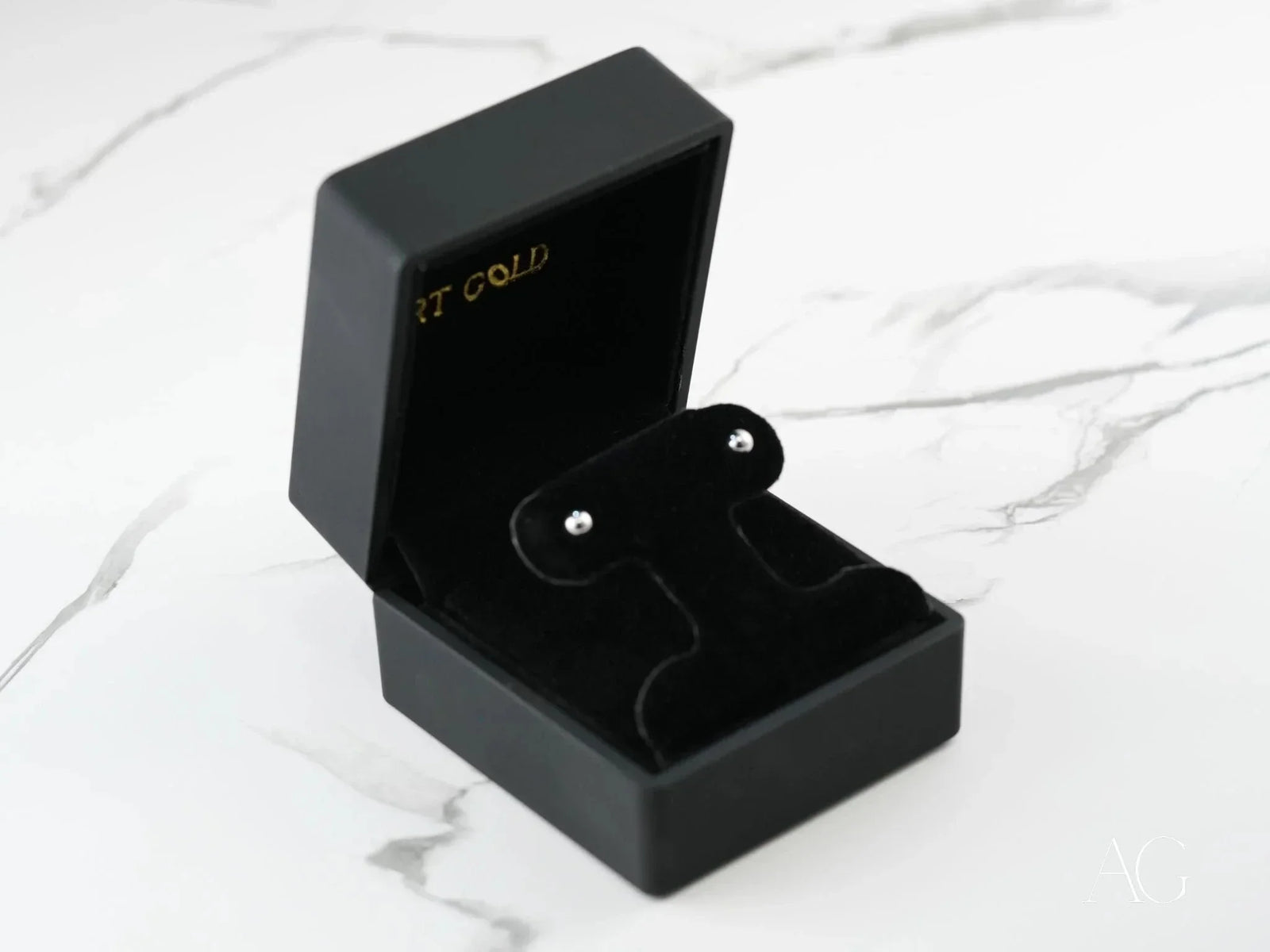 18K white gold 4mm ball earrings in open black velvet jewelry box