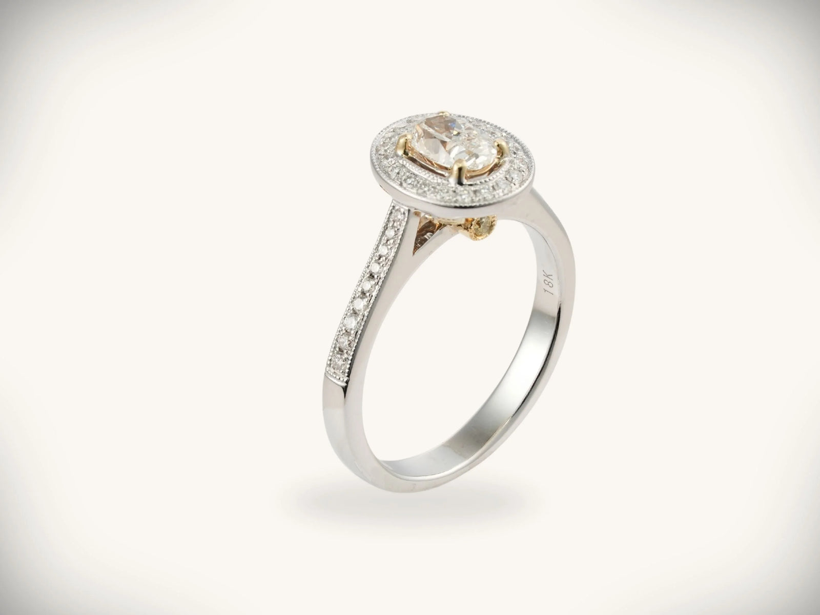 18K white gold 0.5ct oval diamond halo engagement ring