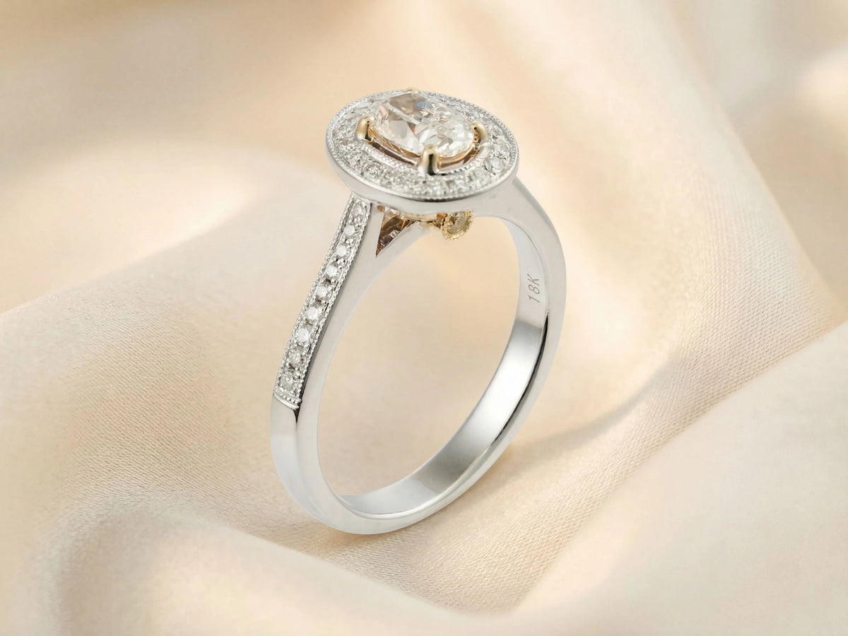 18k white gold 0.5ct oval diamond halo engagement ring