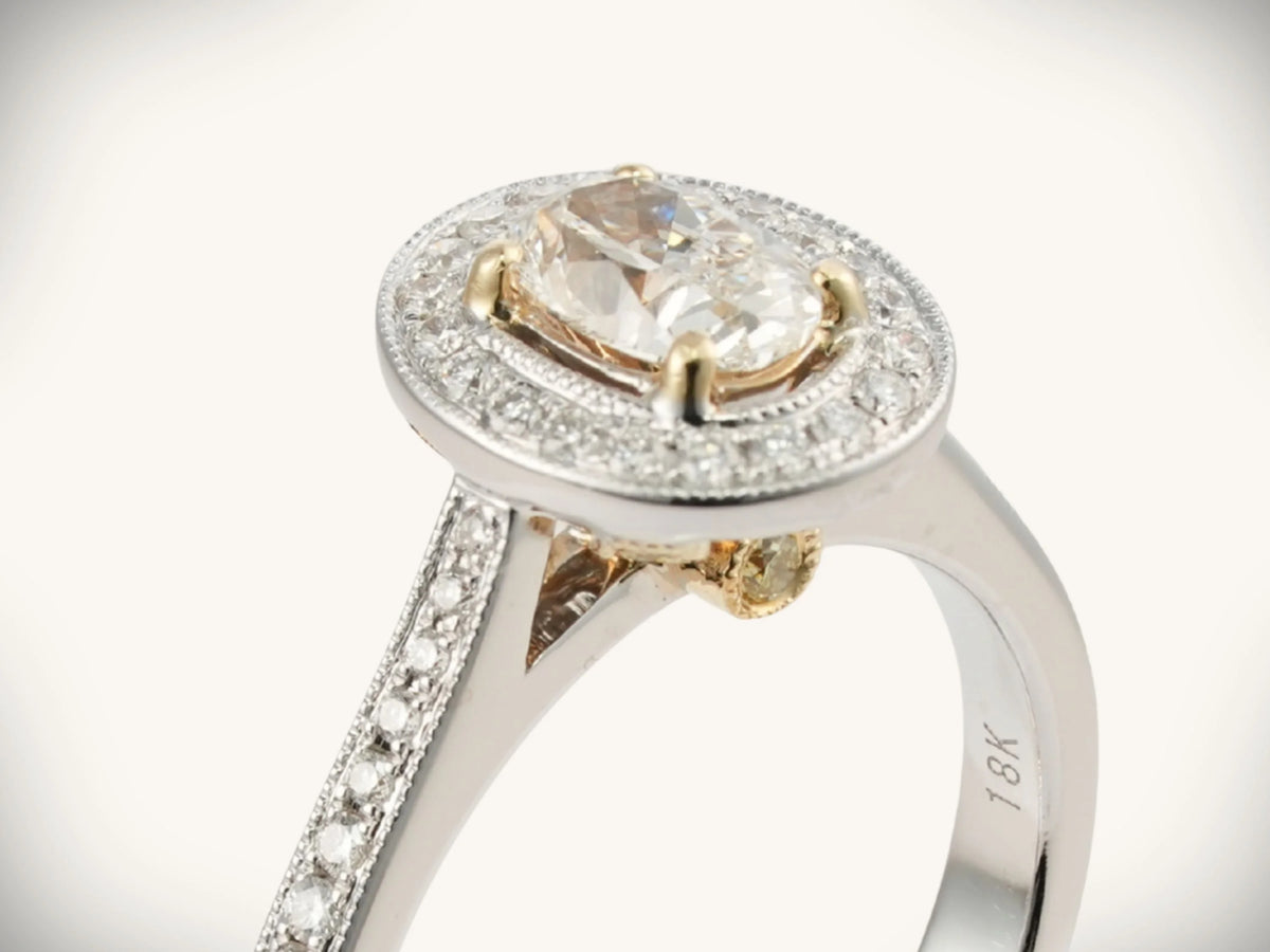 18k white gold 0.5ct oval diamond halo engagement ring