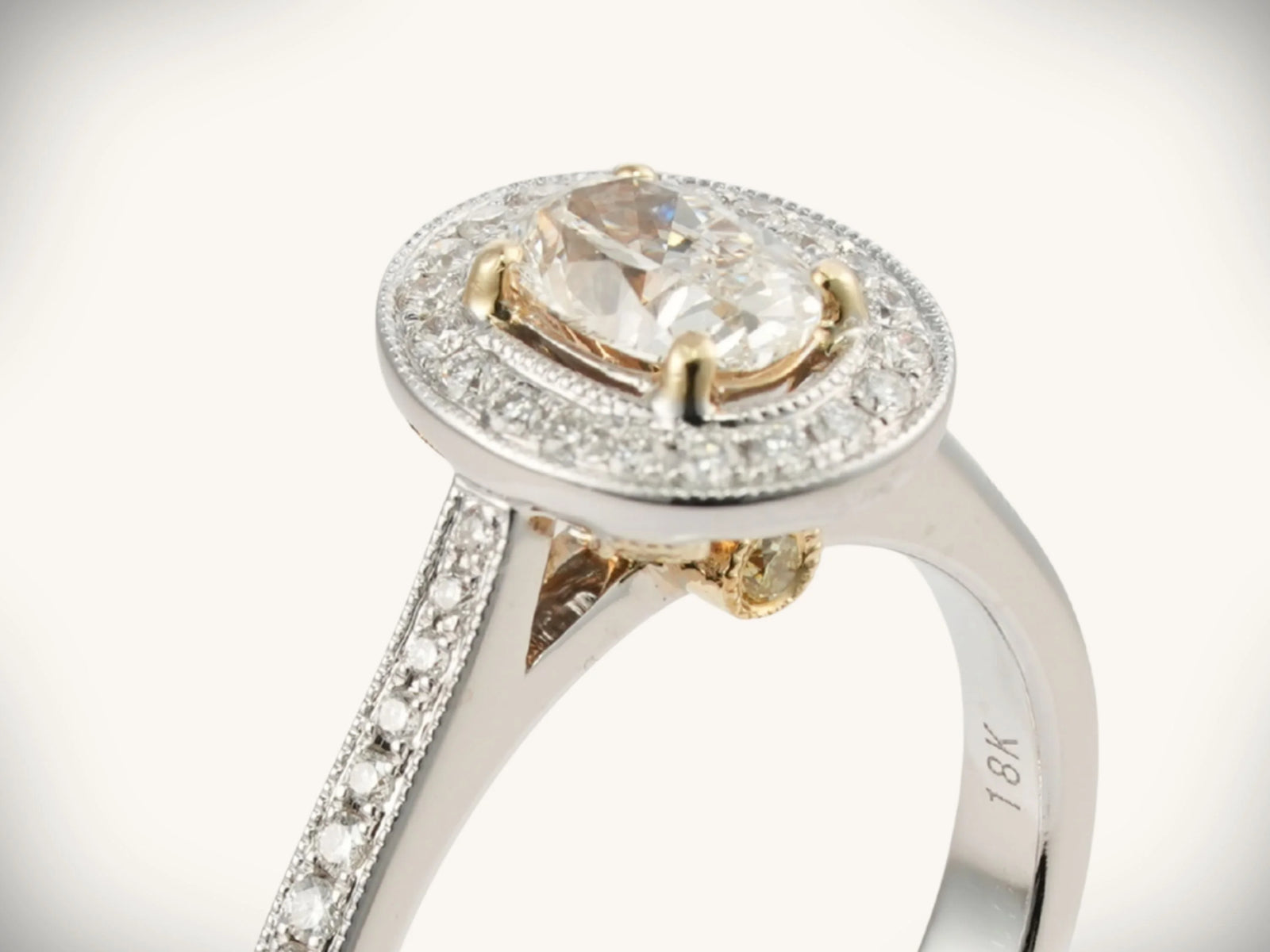 18k white gold 0.5ct oval diamond halo engagement ring