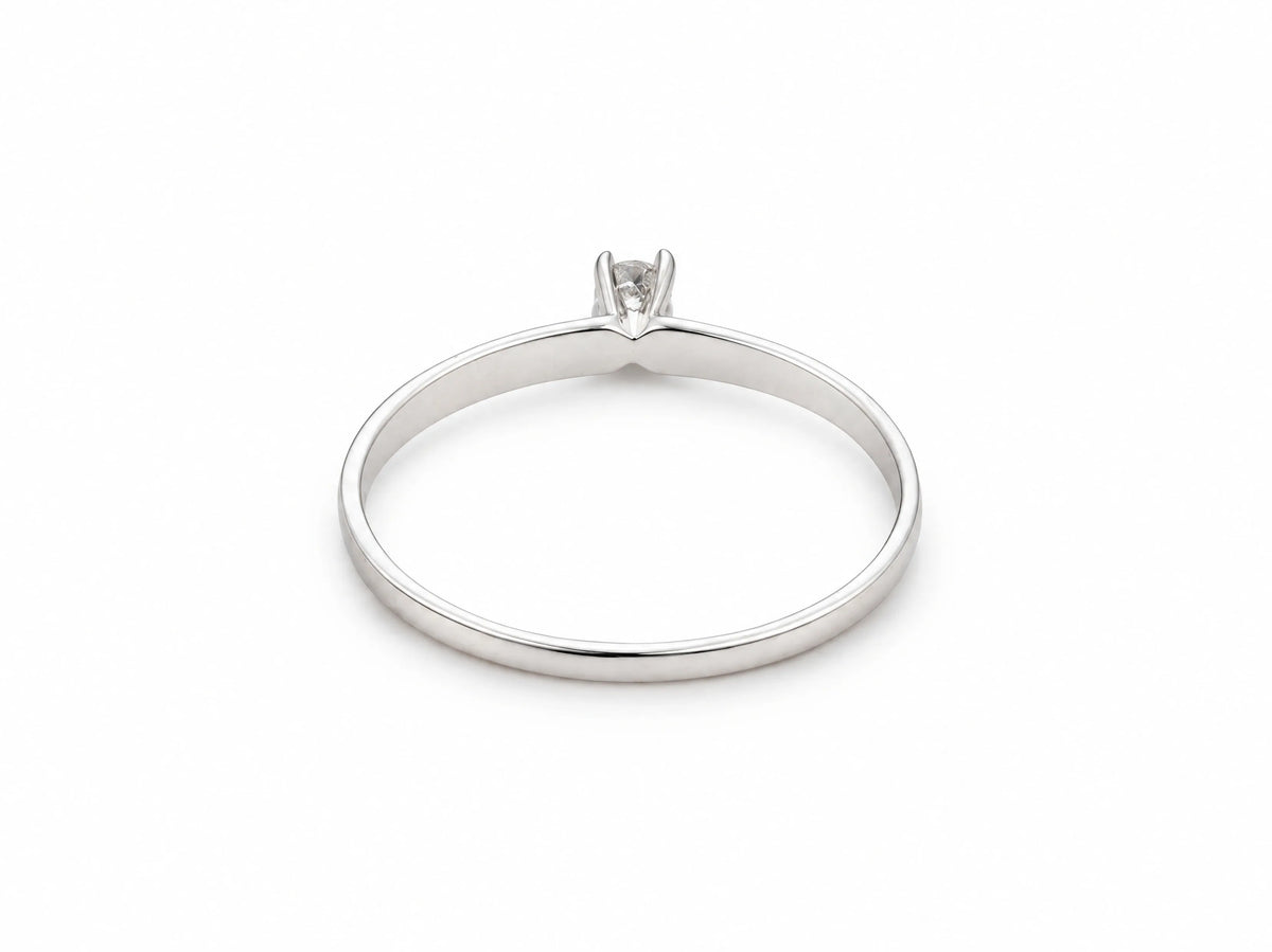 18K white gold diamond solitaire ring, front view of the round diamond in its prong setting