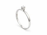18K white gold diamond solitaire ring standing upright, showing the hallmark inside the band
