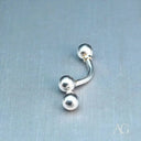18k white gold curved barbell with spherical ends, elegant art gold jewelry piercing