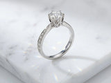 18K white gold engagement ring with 1ct round diamond and accents