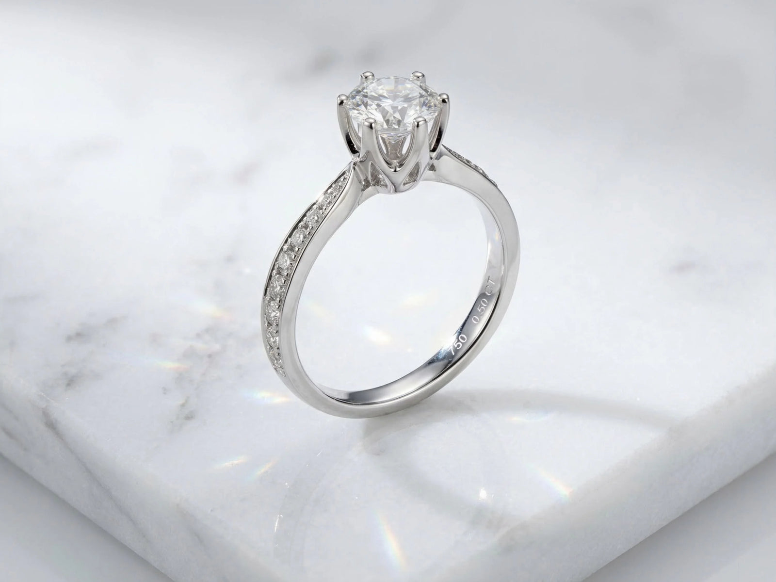 18K white gold engagement ring with 1ct round diamond and accents